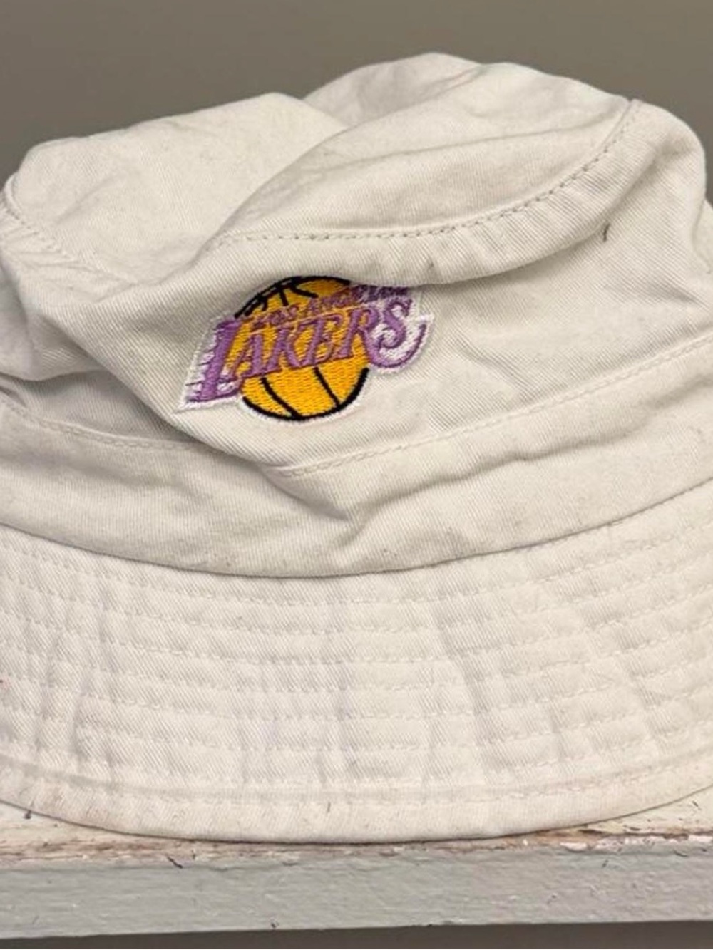 Mitchell & Ness White Lakers Bucket Hat with Purple and Gold Logo